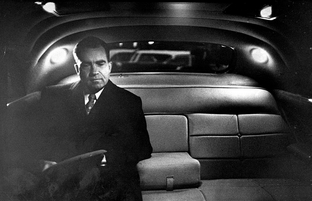 Richard Nixon in his limousine after a day in the White House.